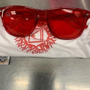 Transparent Red color therapy sunglasses.